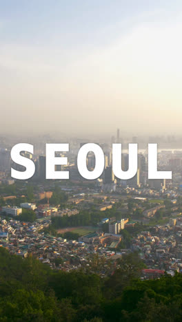 Vertical-Video-Drone-Shot-Of-South-Korean-City-Skyline-Overlaid-With-Animated-Graphic-Spelling-Out-Seoul